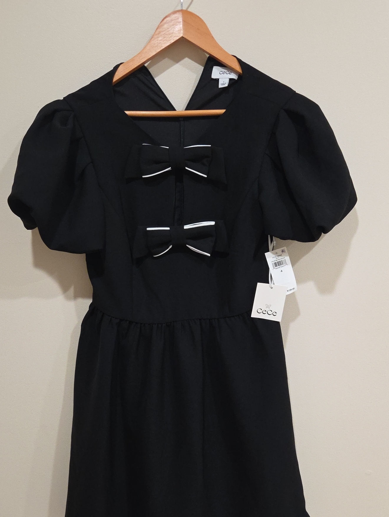 Cece Black Puff Sleeve Dress With Double Bow Accents